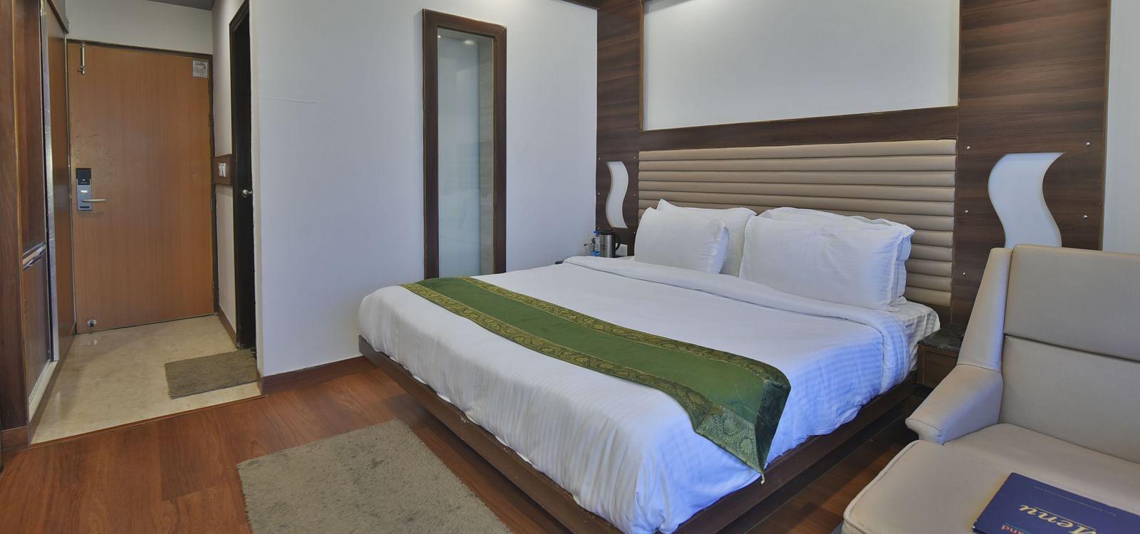 A view of the large bed in the Premium Room at DLS Highland Resort and Spa, Mussoorie.